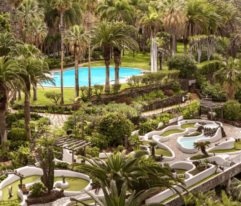 Precise Resort Tenerife outdoor space, pool, mini-golf course. green gardens and palm trees. Best family-friendly hotel in Puerto de la Cruz
