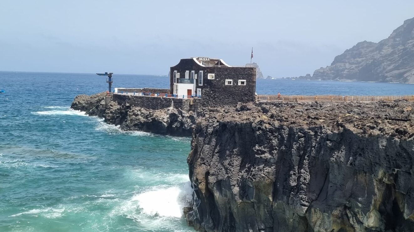 Small stone building on volcanic rock near the ocean in El Hierro