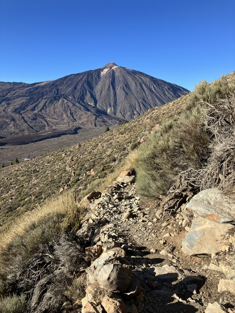 Rocky trail in Teide National Park in Tenerife against a blue sky background. Picture to help determine which Canary Island is right for you