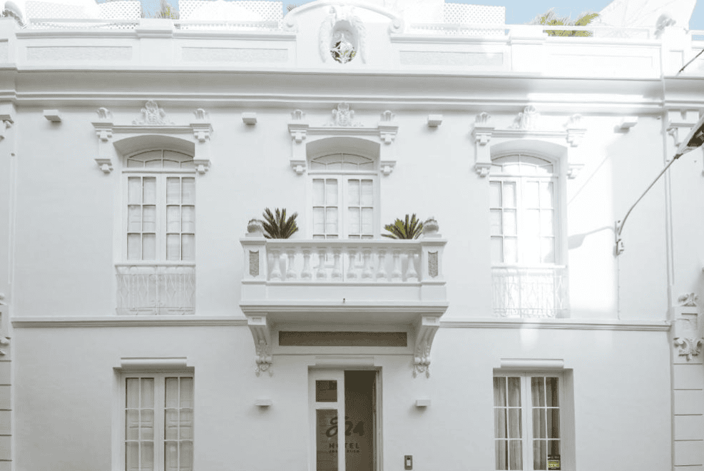 White hotel facade of Emblematico F24, where to stay in Santa Cruz de Tenerife