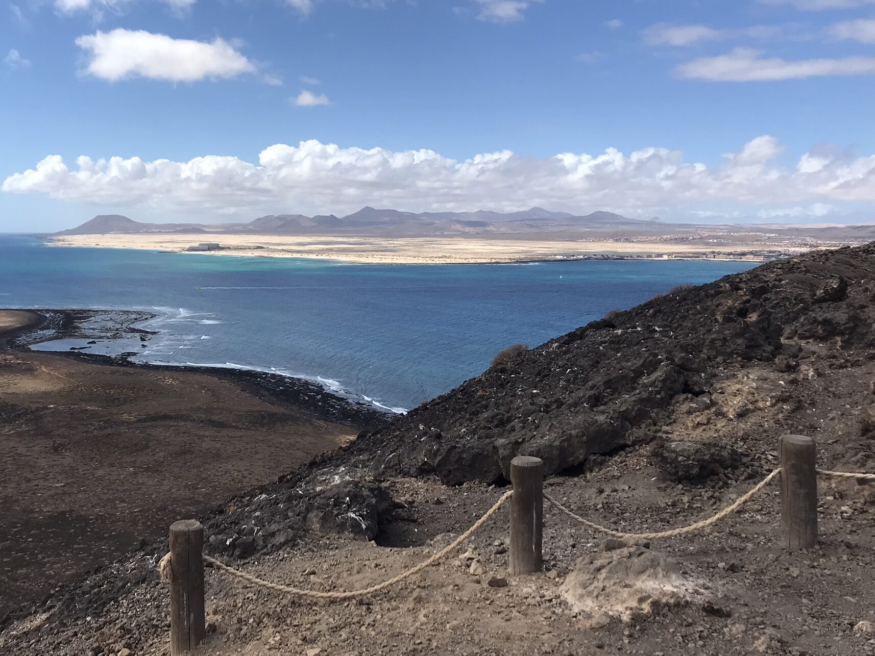 Desolate volcanic rock on Lobos Island, recommended to place visit in the beginner's guide to Fuerteventura