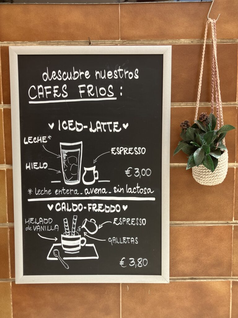 Best cafe in Santa Cruz de Tenerife. Blackboard with white writing regarding cold coffees.