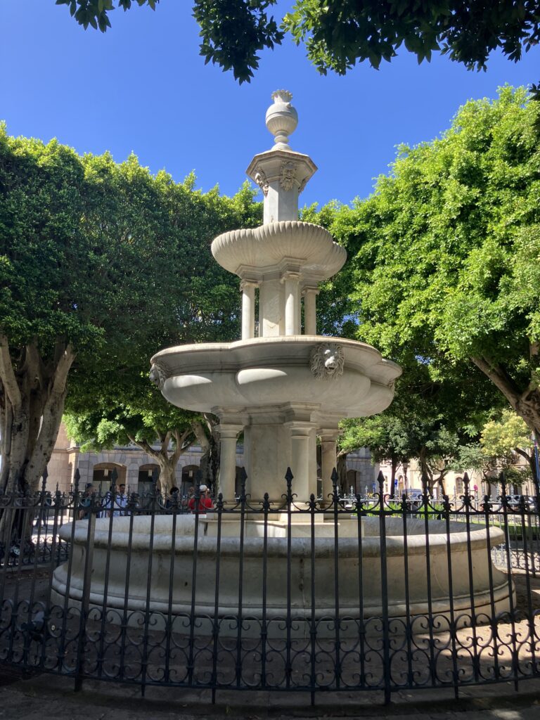 Three tier fountain in Plaza del Adelatando and cobblestone streets in San Cristóbal de La Laguna