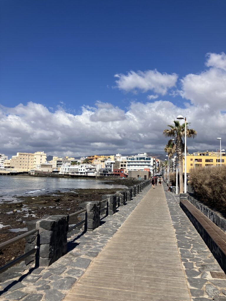 seaside promenade with buildings in the background.